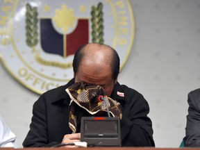 Former police officer Arthur Lascanas wipes his tears as he relates the death of his brothers during a press conference at the Senate in Manila on February 20, 2017. (Getty Images)