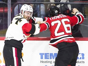 Binghamton Senators defenceman Ben Harpur battles Ben Thomson of the Albany Devils during AHL action earlier this season. (AHL.com)