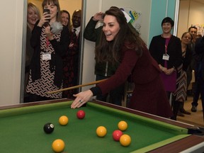 Catherine, Duchess of Cambridge plays pool on a visit to MIST, a child and adolescent mental health project of the charity Action for Children in Torfaen, south Wales on February 22, 2017. (PAUL EDWARDS/AFP/Getty Images)