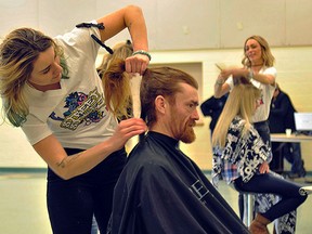 Photo by Agnes Finkle 
Street Stylez sister stylists Payton Williams and Melissa Payton - Van Norman and their team, cut seventy -five heads of hair on Sat. at the Salvation Army Church on Bridge St. East.