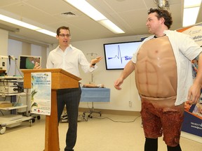 Dr. Rob Anderson, left, medical lead of Health Sciences North Simulation Laboratory, introduces simulation technician Tyler Montroy at the launch of Health Sciences North Foundation Taste St. Beach Party fundraiser in Sudbury, Ont. on Wednesday February 22, 2017. Montroy wore a cut suit used in simulation training. John Lappa/Sudbury Star/Postmedia Network