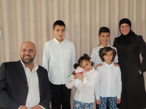 The Hosni family arrived in Canada on Feb. 11, 2016, and have settled well in Napanee, learning English and skills to help them stay here. There was a celebration to mark the anniversary of their arrival on Feb. 18. Front row, from left, are Majed Hosni, Asel Hosni, 6, and Royaa Hosni, 8. Back row, from left, are Mahmoud, 13, Mohammed, 11, and Razan Ahahmad. (Christine Peets/For Postmedia Network)