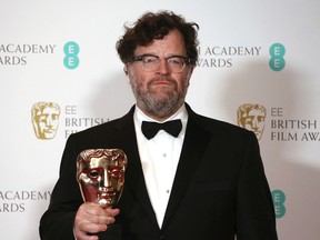 Screenwriter Kenneth Lonergan with his BAFTA award for Best Screenplay for the film 'Manchester By The Sea' backstage at the British Academy Film Awards in London, Sunday, Feb. 12, 2017. (Photo by Joel Ryan/Invision/AP)