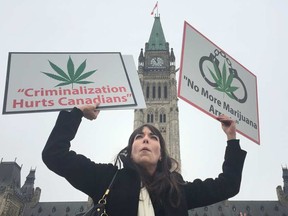 Jodie Emery demonstrates with some friends on Parliament Hill on Wednesday for an end to cannabis arrests and raids. TONY CALDWELL / POSTMEDIA