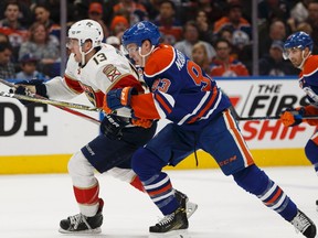 Edmonton's Ryan Nugent-Hopkins (93) races Florida's Mark Pysyk (13) during the first period of a NHL game between the Edmonton Oilers and the Florida Panthers at Rogers Place in Edmonton, Alberta on Wednesday, January 18, 2017.