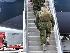 Around 100 soldiers from 1 Canadian Mechanized Brigade Group depart from the International Airport Wednesday, February 22, 2017 to be deployed to Poland for six months as part of Operation Reassurance to support NATO. Ed Kaiser/Postmedia