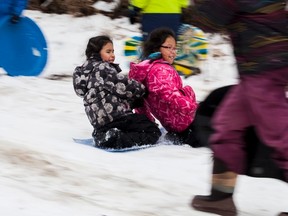 Friends Hailey Smith and Sheray Bull slide through a group of tobogganers at the Vermilion Provincial Park, during a Family Day "Fun-Athlon event, sponsored by the Vermilion Wellness Coalition on Monday, February 20, 2017, in Vermilion, Alta. Taylor Hermiston/Vermilion Standard/Postmedia Network.