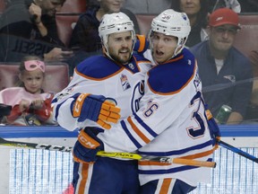 Edmonton Oilers defenceman Kris Russell, left, celebrates with left wing Drake Caggiula (36) after scoring against the Florida Panthers during the third period of an NHL hockey game, Wednesday, Feb. 22, 2017, in Sunrise, Fla. The Oilers defeated the Panthers 4-3.