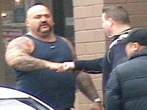 Undated handout photo of UN gang member Ion William Kroitoru meeting Clay Roueche. Both men have been charged with conspiracy to murder the Bacon brothers and their Red Scorpion gang associates.