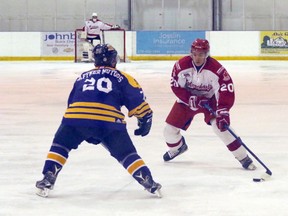 Norwich Merchants forward Mason Cooper, right, attempts to get around New Hamburg Firebirds defenceman Chris Eckert in their Provincial Junior Hockey League quarterfinal series. The Merchants will play the defending Schmalz Cup champion Ayr Centennials in the second round. Greg Colgan/Woodstock Sentinel-Review/Postmedia Network