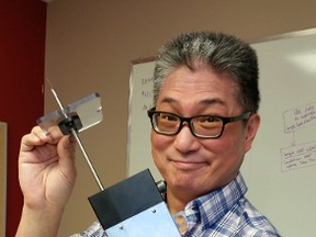 Viewtrak co-president Hubert Lau holds one of the Edmonton company’s leading products, the PG-207 pork probe.