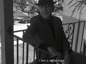 Singer Leonard Cohen is seen talking and smoking a cigarette on a balcony in a tribute video created by his son. (YouTube screengrab)