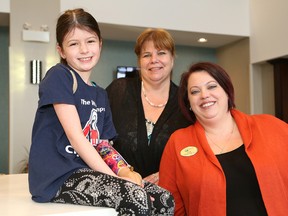 Sudbury native Sophia Carlson, 7, a member of the War Amps Child Amputee Program (CHAMP), was on hand to accept a donation on behalf of CHAMP, from Katherine VanDuinkerken, middle, and Lisa Garrett, of Homewood Suites and Hampton Inn in Sudbury, Ont. on Thursday February 23, 2017. John Lappa/Sudbury Star/Postmedia Network