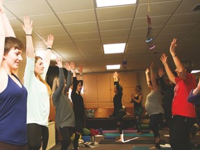 Yoga instructors Martha Affleck, left, Jacqueline Knauft, Karen Williams and Jenna McDonald show their 23 students the tree pose during the yoga workshop held at the Vulcan United Church on Feb. 11. Jasmine O’Halloran Vulcan Advocate