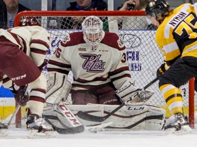 Peterborough Petes goaltender Sam Smith stops a shot from Kingston Frontenacs' Linus Nyman during the first period of Ontario Hockey League action at the Rogers K-Rock Centre in Kingston. (JULIA MCKAY/The Whig-Standard)