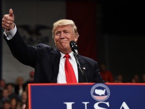 Donald Trump speaks in Des Moines, Iowa on December 8, 2016 during the USA Thank You Tour 2016 at the Hy-Vee Hall in the Iowa Events Center. / AFP / TIMOTHY A. CLARY (Photo credit should read TIMOTHY A. CLARY/AFP/Getty Images)