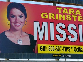 The Wednesday, Oct. 4, 2006, file photo of missing teacher Tara Grinstead is prominently displayed on a billboard in Ocilla, Ga., Grinstead's disappearance on Oct. 22, 2005. (AP Photo/Elliott Minor, File)