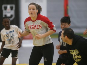 Leah Ferguson, a former Olympian and current U of W wrestling coach, leads youngsters during a clinic on Thursday. (Winnipeg Sun/Postmedia Network)