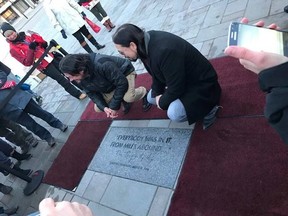 The Tragically Hip’s Paul Langlois, left, and Rob Baker attend the Feb. 2 unveiling of a commemorative brick in Spring Market Square. (Supplied photo)