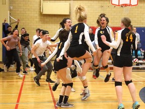 Jubilant fans rush the court as members of the Oakridge Oaks celebrate their  WOSSAA  senior girls volleyball championship Thursday night in London. The host Oaks rallied to beat Lucas Vikings 3-2 to advance to the OFSAA provincial championship. (MIKE HENSEN, The London Free Press)