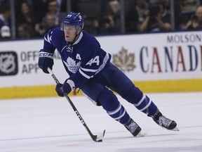 Defenceman Morgan Rielly (top) admires fellow Leaf 
Alexey Marchenko’s ability to pass and read the ice well.  (Jack Boland/Toronto sun)