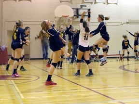 The College Avenue Knights celebrate the final point to win WOSSAA in London, Ont. at 'AA' WOSSAA senior girls' volleyball finals against Stratford St. Mike's on Thursday February 23, 2017. CASS won 3-1 and advance to OFSAA. Greg Colgan/Woodstock Sentinel-Review/Postmedia Network