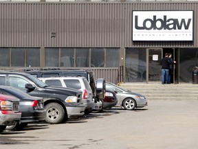 Loblaws employees enter the Loblaws Companies Limited warehouse at 16104 - 121A Ave., in Edmonton Alta., on Thursday April 3, 2014. Two people were killed and four others injured in a multi-stabbing at the warehouse on Feb. 28, 2014. David Bloom/Edmonton Sun