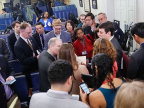 Reporters line up in hopes of attending a briefing in Press Secretary Sean Spicer's office at the White House in Washington, Friday, Feb. 24, 2017. (AP Photo/Pablo Martinez Monsivais)