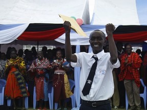 A boy celebrates the opening of Ngulot High School in Kenya’s Masaai Mara in January.