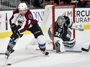 In this Oct. 8, 2016, file photo, L.A. Kings goalie Jonathan Quick defends as Colorado Avalanche's Matt Duchene works the puck near the goal during an NHL pre-season game in Las Vegas. (AP Photo/David Becker, File)