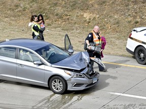 Emergency responders carry Aylin Sofia Hernandez after police were involved in a high speed pursuit and crash involving a car driven by her father, who is suspected in her mother's killing, on I-99 North bound at the Shiloh Road interchange, near College Township, Pa, on Friday, Feb. 24, 2017. (Abby Drey/Centre Daily Times via AP)