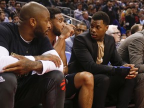 Raptors’ Kyle Lowry sits on the bench last night wearing a wrist guard. He injured it in his final game before the all-star break, but still played in the all-star game. (JACK BOLAND/Toronto Sun)