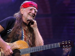 In this Sept. 9, 2007, file photo, Willie Nelson performs at Farm Aid on Randall's Island in New York. (AP Photo/Jason DeCrow, File)