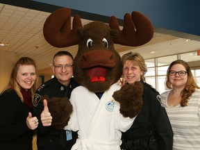 Polar Plunge organizing committee members Natalie Corcoran, left, and Heather Lewis, right, Greater Sudbury Deputy Police Chief Al Lekun and Sgt. Joanne Pendrak are ready to take the plunge on March 4 in Sudbury, Ont. John Lappa/Sudbury Star/Postmedia Network