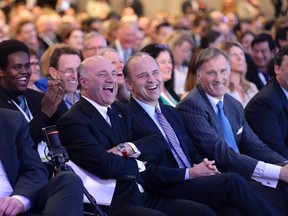Kevin O'Leary, Rick Peterson and Maxime Bernier laugh during a Conservative Party leadership debate at the Manning Centre conference.