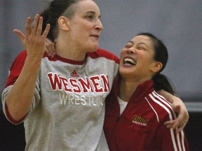 Carol Huynh, former Canadian Olympic Gold Medalist (right) and Leah Ferguson Wesman wrestling assistant coach, and former Olympian, share a joke at the University of Winnipeg today. Thursday, February 23, 2017. Chris Procaylo/Winnipeg Sun/Postmedia Network