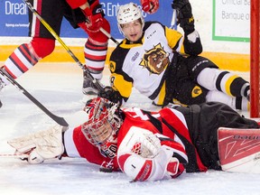 Ottawa 67's goalie Leo Lazarev makes a save against Hamilton Bulldogs' Joseph Mizzi during OHL action at TD Place Arena in Ottawa on Saturday, Feb. 25, 2017. (Ashley Fraser/Postmedia)