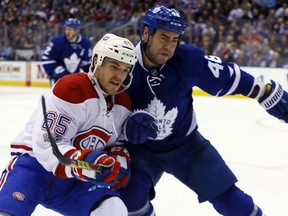 Maple Leafs defenceman Roman Polak (right) battles for position with Andrew Shaw of the Canadiens during NHL action at the Air Canada Centre in Toronto on Saturday, Feb. 25, 2017. (Dave Abel/Toronto Sun)