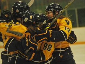 Members of the Laurentian Voyageurs women's hockey team celebrate a goal during Game 2 of a OUA quarter-final series at Gerry McCrory Countryside Sports Complex on Saturday night. The Lady Vees won 4-3 to force a deciding Game 3 on Sunday in North Bay. Keith Dempsey/For The Sudbury Star