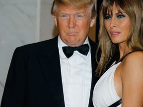 In this April 30, 2011, file photo Donald Trump, left, and Melania Trump arrive for the White House Correspondents' Dinner in Washington.  (AP Photo/Alex Brandon, File)