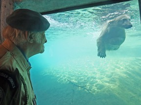 Former UN peacekeeper Gerry O'Pray, 76, who shares a birthday with Juno the polar bear, gets a chance to feed the bear on Sunday, Feb. 26, 2017 before the animal departs for the Winnipeg Zoo. (DAVE ABEL/TORONTO SUN)