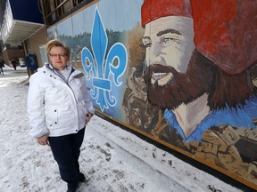 Gloria Cardwell-Hoeppner, Executive Director of West End BIZ, stands with a mural on Spence Street. Saturday, February 25, 2017. Chris Procaylo/Winnipeg Sun/Postmedia Network