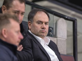 GM Pierre Dorion watches practice from the stands as the Ottawa Senators practice on game day before meeting the Carolina Hurricanes. (Wayne Cuddington/ Postmedia Network)