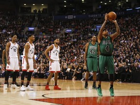 Isaiah Thomas of the Boston Celtics shoots a free throw Friday after a flagrant foul by Toronto’s DeMarre Carroll. (JACK BOLAND/Toronto Sun)