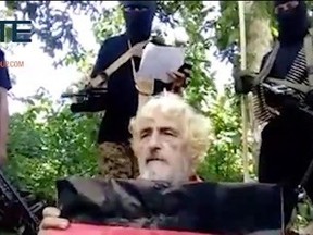 In this undated image made from militant video and released by SITE Intel Group on Feb. 24, 2017, shows German hostage Jurgen Gustav Kantner at an undisclosed location. Abu Sayyaf extremists in the Philippines have released a video of the beheading of Kantner. The brief video circulated Monday, Feb. 27, by the SITE Intelligence Group, which monitors jihadi websites, is the first sign that the brutal militants proceeded with their threat to kill Kantner in the southern Philippines after a Sunday ransom deadline lapsed. (SITE Intel Group via AP)