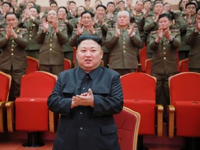 This picture taken on February 22, 2017 and released by North Korea's official Korean Central News Agency (KCNA) on February 23 shows North Korean leader Kim Jong-Un (C) visiting the People's Theatre to mark the 70th anniversary of the founding of the State Merited Chorus in Pyongyang. AFP PHOTO