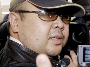 This file photo taken on February 11, 2007 shows a man believed to be then-North Korean leader Kim Jong-Il eldest son, Kim Jong-Nam, surrounded by journalists upon his arrival at Beijing's capital airport.  AFP PHOTO