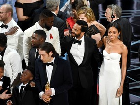 Cinematographer James Laxton, actors Trevante Rhodes, Alex R. Hibbert, Jaden Piner, writer Tarell Alvin McCraney, actor Naomie Harris, and producer Jeremy Kleiner accept Best Picture for 'Moonlight' onstage during the 89th Annual Academy Awards at Hollywood & Highland Center on February 26, 2017 in Hollywood, California. (Photo by Kevin Winter/Getty Images)