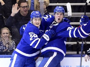 Toronto Maple Leafs' Auston Matthews (34) and teammate William Nylander (29) celebrate after Matthews' second goal during third period NHL action against the Montreal Canadiens in Toronto on Saturday, February 25, 2017. THE CANADIAN PRESS/Frank Gunn