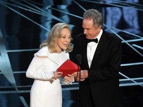 Actors Faye Dunaway (L) and Warren Beatty speak onstage during the 89th Annual Academy Awards at Hollywood & Highland Center on February 26, 2017 in Hollywood, California. (Photo by Kevin Winter/Getty Images)